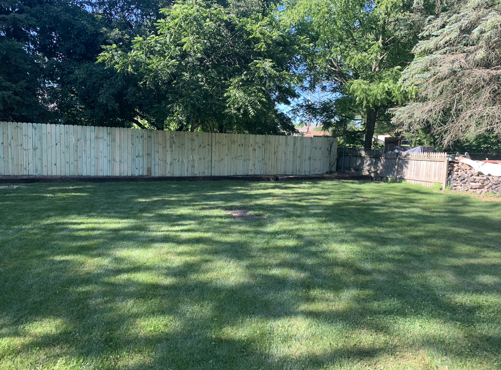 After: installed privacy fence with clean lines